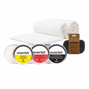 The Hair Hydration & Skin Smoothing Essentials Tins: Shampoo Concentrate Tin, Deep Conditioning Concentrate Tin, Exfoliationg Body Wash Tin, Exfoliating Konjac Sponge, and Quick-Dry Hair Towel